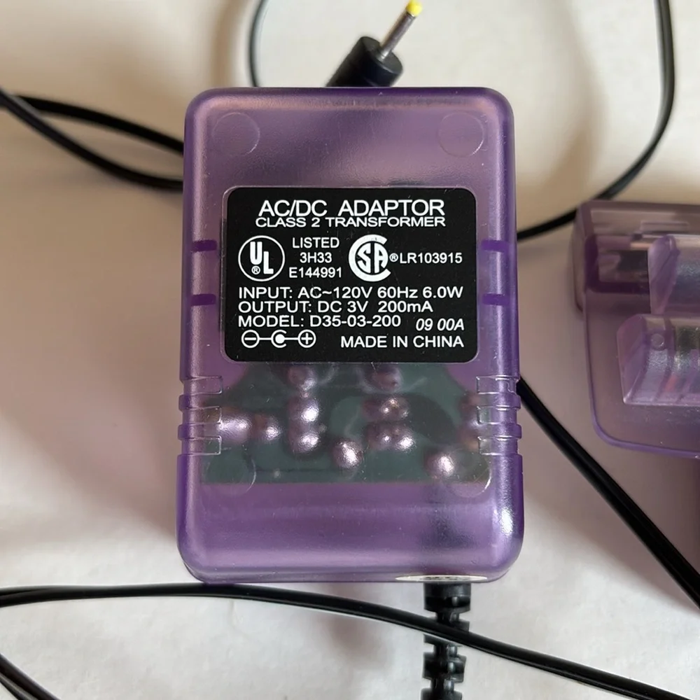 AC/DC power adapter and 2 battery packs for Nintendo Game Boy Color